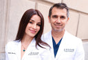 Two doctors in white lab coats with 'Kassir' on a building background